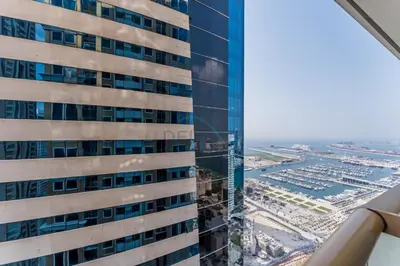 an aerial view of a tall building at Refurbished 1BR High-Floor Unit with Partial City & Sea Views, Walking Distance to the Beach, Elite Residence, Dubai Marina by Deluxe Holiday Homes in Dubai