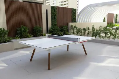 a ping pong table in the middle of a building at Elegant 1BR in JVC in Dubai
