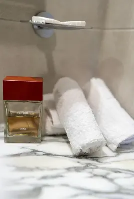 two rolls of toilet paper sitting on top of a bed at Luxury 2BR above the clouds on38 in Dubai