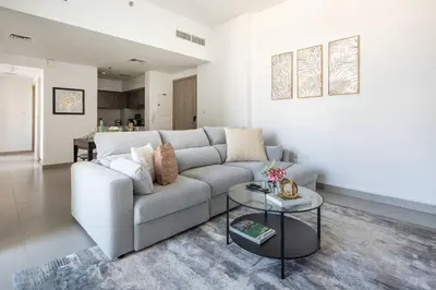 a living room with a couch and a table at Frank Porter - Prive Residence in Dubai