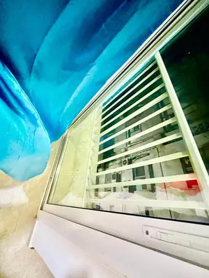a window with a view of a building at Haifa building in Dubai