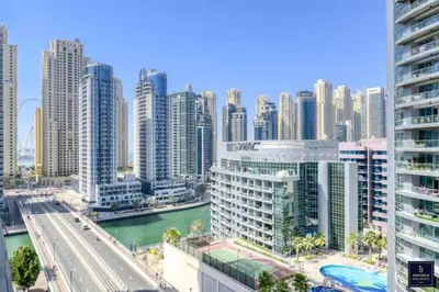 a view of a city with a river and buildings at Big Studio Apartment in Dubai Marina Walking to JBR Beach, Cruise and DMCC Metro in Dubai