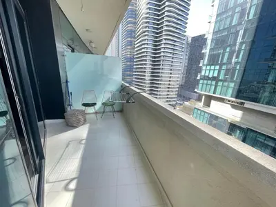 a balcony of a building with two chairs on it at Unmatched luxury perfectly located next to Dubai Mall and Burj Khalifa in Dubai