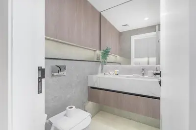 a bathroom with a toilet and a sink at Bright & Modern Studio - Legacy By Sunrise - Arjan in Dubai