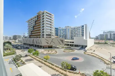 an aerial view of a city with a building at Bright & Modern Studio - Legacy By Sunrise - Arjan in Dubai