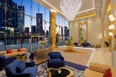 a large room with a view of a city at Vogue Business Bay Damac Maison Prive near Burj Khalifa and Dubai Mall, Studio Apartment with Balcony, Canal and City View, Access to all Amenities in Dubai