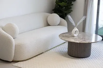 a living room with a couch and a table at Binghatti House in JVC - New Apartment in Dubai