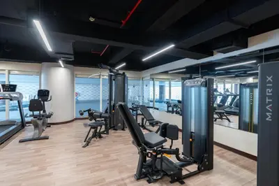 a gym with treadmills and exercise equipment in a building at Stylish 1-Bedroom with Breathtaking Views at Dubai Marina in Dubai