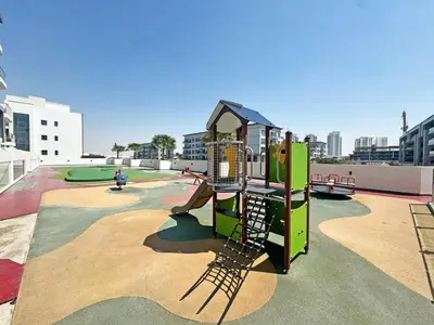 a playground with a slide in a park at Great deal Magnificent Brand New with Private PooL in Dubai