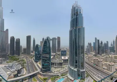 an aerial view of a city with tall buildings at Creston Suites The Dubai Mall Residences in Dubai