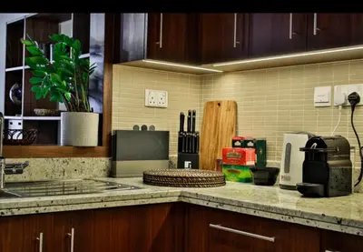 a kitchen with a counter top with a sink and a stove at 