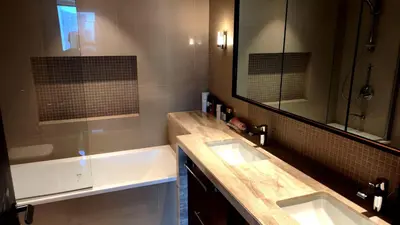 a bathroom with two sinks and a large mirror at 