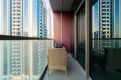 a room with a view of a city with tall buildings at SettlerHomes - Chic JLT 29 Floor Near Panoramic Lake in Dubai