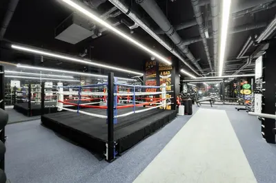 a room with two boxing rings in a gym at SettlerHomes - Chic JLT 29 Floor Near Panoramic Lake in Dubai