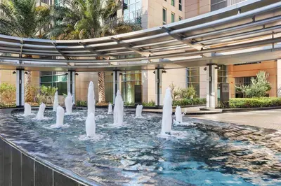 a water fountain in front of a building at FIRST CLASS 2BR Spectacular Fountain Views in Dubai