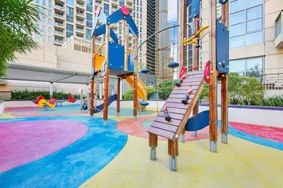 a playground with a slide and slides at FIRST CLASS 2BR Spectacular Fountain Views in Dubai
