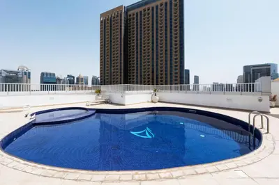 a large swimming pool on the roof of a building at 2 Bed in Atlantic Tower 2 by PK Holidays in Dubai