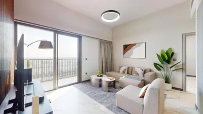 a living room with a couch and a tv at Mag Eye 910 - Magnificent One Bedroom in Meydan in Dubai