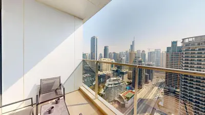 a balcony with a view of a city at Vacationer I Luxury 2BR I Marina Views I Close to JBR Beach I Sparkle Tower in Dubai