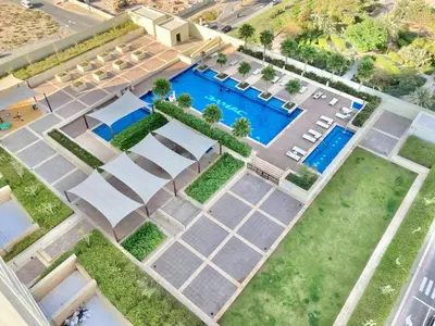 an overhead view of a swimming pool in a building at Ahlan HH - Luxury 2BR Damac Tower 108 at High Floor in Dubai