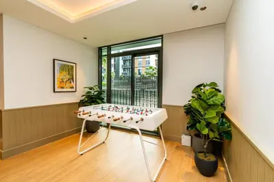 a room with a table with balls on it at Sleek & Modern 1BR with Luxury Pool in JVC in Dubai