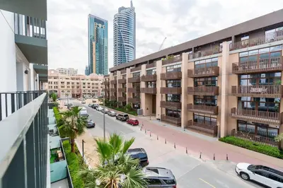 a view of a city street with buildings and cars at Sleek & Modern 1BR with Luxury Pool in JVC in Dubai