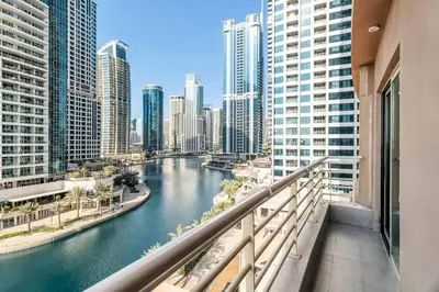 a view of a river in a city with tall buildings at GuestReady - Beautiful home in the JLT area in Dubai