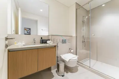 a bathroom with a sink and a toilet and a shower at Community View 2BR with Balcony, Surf at Creek Beach Building 2, Creek Harbour by Deluxe Holiday Homes in Dubai