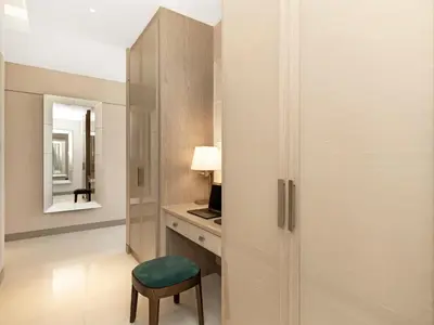 a room with a desk with a chair and a mirror at FIVE luxe JBR - High Floor Studio - Pool & Beach Access - Ventura Stays in Dubai