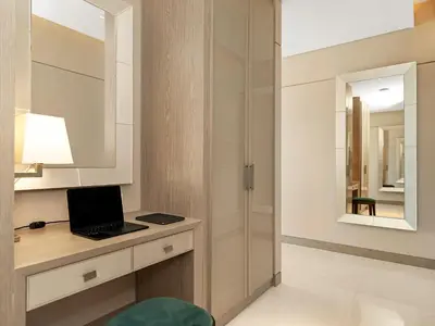 a bathroom with a desk with a laptop on it at FIVE luxe JBR - High Floor Studio - Pool & Beach Access - Ventura Stays in Dubai