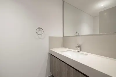 a bathroom with a sink and a mirror at Fresh New 2 Bedroom! Amazing Burj Khalifa View! 5-star Pool & Gym Access! in Dubai