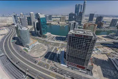 a view of a city with many buildings and highways at 5 minutes walk to Dubai mall and Burj Khalifa in Dubai