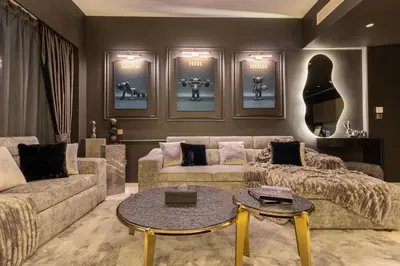 a living room with a couch and a table at Brand New LUXE Downtown Dubai 46th Floor in Dubai