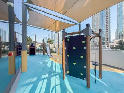 a gym with a climbing wall with balls on it at Hermes-Style 2BR, Full Burj Khalifa View - Infinity Pool - Full Fountain View in Dubai