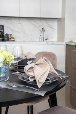 a black table with a napkin on top of it at Frank Porter - Beach Vista Tower 2 in Dubai