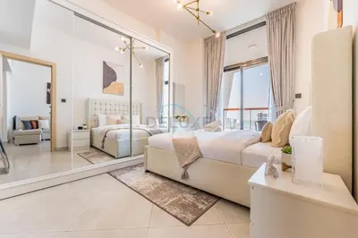 a bedroom with a bed and a living room at Community View 1BR with Balcony Near Downtown Dubai, Binghatti Avenue, Al Jaddaf by Deluxe Holiday Homes in Dubai