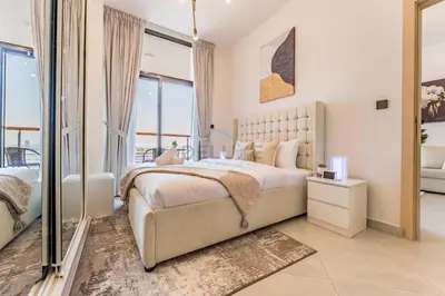 a bedroom with a large bed and large windows at Community View 1BR with Balcony Near Downtown Dubai, Binghatti Avenue, Al Jaddaf by Deluxe Holiday Homes in Dubai