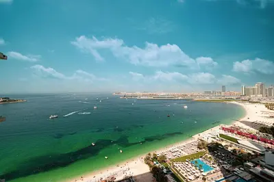 an aerial view of a beach with people and the ocean at La Vie in JBR! Private Beach! Excellent Apartments! in Dubai