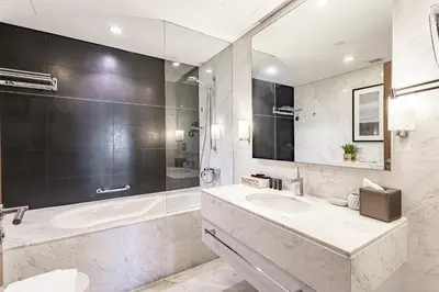 a bathroom with a tub and a sink and a shower at SuperHost EMAAR Residences - Former Address Dubai Mall in Dubai