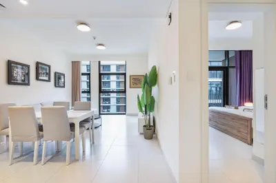 a dining room with a table and chairs at Premium Home in Park Point Near Dubai Hills Mall in Dubai