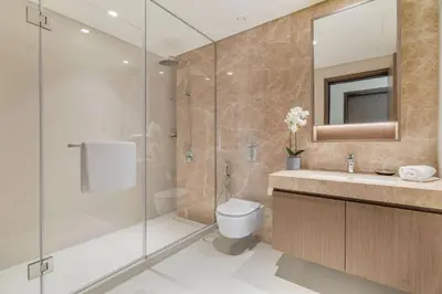 a bathroom with a shower and a toilet and a sink at GuestReady - Amazing home with a Great sea view in Dubai