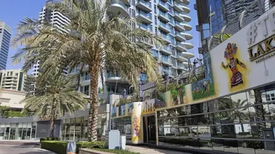 a palm tree in front of a building at Condor Marina Star Seaview Studio, Dubai Marina in Dubai