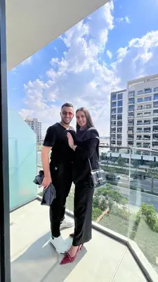 a man and woman standing on top of a building at AMLY holiday home DUBAI in Dubai