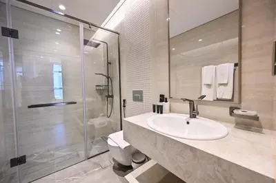 a bathroom with a sink and a shower at Stunning 1Bdr Luxury with Burj Khalifa View in Dubai