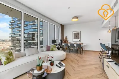 a living room with a white couch and a large window at Keysplease 2BR Minutes to WTC and Downtown, Al Wasl Zaabeel Park in Dubai