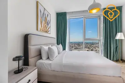 a bedroom with a large bed and a large window at Keysplease 2BR Minutes to WTC and Downtown, Al Wasl Zaabeel Park in Dubai