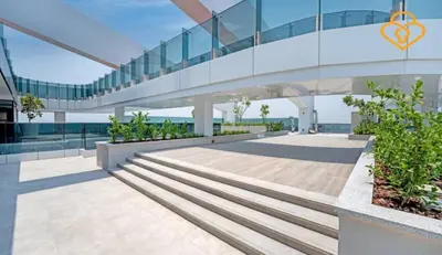 a glass building with stairs in front of it at Keysplease 2BR Minutes to WTC and Downtown, Al Wasl Zaabeel Park in Dubai
