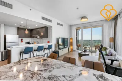 a kitchen and living room with a table and chairs at Keysplease 2BR Minutes to WTC and Downtown, Al Wasl Zaabeel Park in Dubai