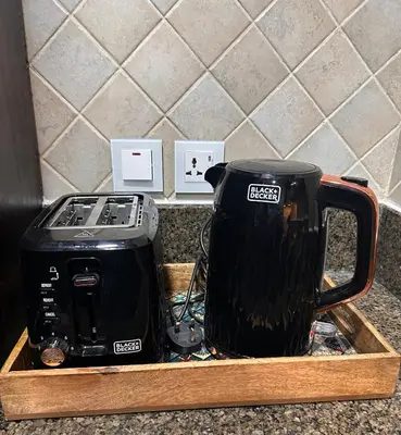 a toaster and a toaster sitting on a counter at Dubai mall Aparment in Dubai