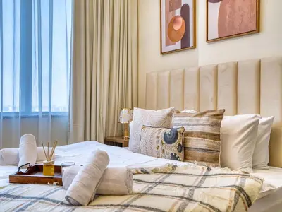 a bedroom with a bed with a large window at Classic Sky Studio Bright in Dubai